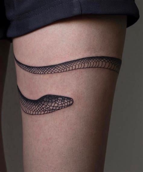 snake wrapped around leg tattoo|100+ Charming Snake Tattoo Designs with Meaning。